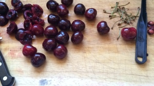 Photo of cherries on cutting board.